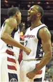  ?? TOMMY GILLIGAN, USA TODAY SPORTS ?? Wizards guard John Wall, right, is averaging a careerhigh 22.9 points per game.