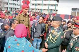  ??  ?? A seven-ft-three-inch tall recruit was the star attraction at an Army passing out parade in Srinagar on Monday. Around 219 recruits, many from Kashmir Valley, were part of the Army’s Recruit Course 113 and have completed one year of strenuous training.