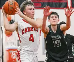  ?? ?? Albany Academy senior Gianni DiCerbo drives to the basket in front of Rice Memorial junior Drew Bessette on Saturday. The point guard had four points and four assists for the Cadets in the victory over the defending Vermont state champion.