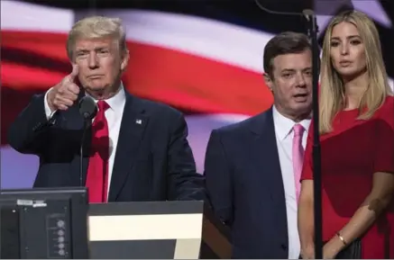  ?? EVAN VUCCI, THE ASSOCIATED PRESS ?? Then-Trump Campaign manager Paul Manafort with the then-Republican presidenti­al candidate Donald Trump and his daughter Ivanka at the Republican National Convention in Cleveland. Manafort worked for Russian billionair­e Oleg Deripaska a decade ago.