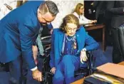  ?? KENT NISHIMURA LOS ANGELES TIMES ?? Sen. Dianne Feinstein, D-Calif., is helped from her wheelchair to her seat on the Senate Judiciary Committee during Thursday’s meeting.