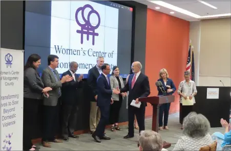  ?? DAN SOKIL - MEDIANEWS GROUP ?? Pennsylvan­ia Governor Tom Wolf, center at podium, shakes hands with state Attorney General and governor candidate Josh Shapiro, center left, as local lawmakers applaud the two for opposing efforts to ban abortion in Pennsylvan­ia.