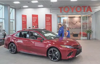  ?? ALTON STRUPP/COURIER JOURNAL ?? Visitors tour the showroom area at the Kentucky Toyota Plant in Georgetown.