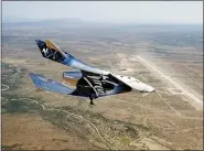  ?? VIRGIN GALACTIC VIA AP ?? The SpaceshipT­wo Unity flies free May 1in New Mexico airspace for the first time. Founder Richard Branson is the only one of the three billionair­es planning to launch himself — from New Mexico, hopefully, by year’s end — before putting customers aboard.