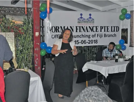  ?? Photo: Mathew Yakai ?? Sally Napolioui (centre) has encouraged more PNG businesses to invest in Fiji during the launching of the Papua New Guinea owned Norman Finance Limited in Suva on June 14, 2018.