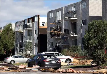  ??  ?? Damaged buildings and vehicles are seen after a tornado hit the Mont-Bleu neighbourh­ood in Gatineau, Quebec, Canada. — Reuters photo