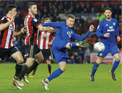  ?? ACTION IMAGES ?? Late show: Anthony Pilkington hits a 91st-minute equaliser to keep Cardiff in the title hunt