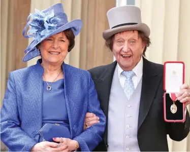  ??  ?? Honour: Ken Dodd with Anne after being knighted at Buckingham Palace last year