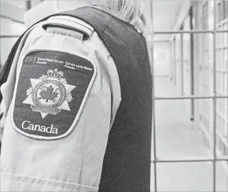  ?? LARS HAGBERG THE CANADIAN PRESS ?? A correction­al officer looks on at the Collins Bay Institutio­n in Kingston, on Tuesday, May 10, 2016, during a tour of the facility. A mandate letter has been given to Canada's new correction­s commission­er.