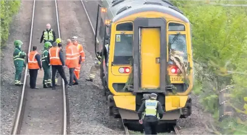  ??  ?? Damage report The ScotRail train that collided with a fallen tree on May 21 near Glencarse