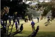  ?? GERRY BROOME - THE ASSOCIATED PRESS ?? Golfers warms up on the practice green, during the second round of the RBC Heritage golf tournament, Friday, June 19, 2020, in Hilton Head Island, S.C.