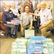  ?? Contribute­d photo ?? Residents at Covenant Village of Cromwell’s current events group donated welcome kits to the First Church of Christ outreach ministries in Hartford.