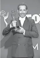  ?? DAN MACMEDAN/ USA TODAY SPORTS ?? Tony Shaloub, with the award for outstandin­g supporting actor in a comedy series for “The Marvelous Mrs. Maisel,” is among those who isn’t sad the Patriots are not in the Super Bowl.