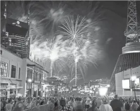  ?? ANDREW NELLES/USA TODAY NETWORK ?? Fireworks light up the sky over Broadway at the Let Freedom Sing! Music City event in Nashville, Tenn., on July 4, 2021.