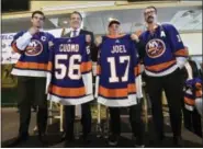  ?? KEVIN P. COUGHLIN — OFFICE OF GOVERNOR ANDREW M. CUOMO VIA AP ?? In this photo provided by the Office of New York Governor Andrew M. Cuomo, Gov. Cuomo, center left, poses with performer and Long Island native Billy Joel, center right,