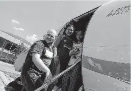  ?? Courtesy photo / Associated Press ?? Joshua Holt, his wife, Thamara Caleno, and her daughter Marian Leal board a plane at the airport in Caracas, Venezuela, bound for Washington, D.C. Holt had been held for two years in Venezuela, accused of being the CIA’s top spy in Latin America.