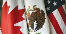  ?? (Reuters) ?? FLAGS ARE PICTURED during the fifth round of NAFTA talks involving the US, Mexico and Canada, in Mexico City in November.