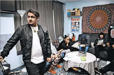  ?? ERIN HOOLEY/CHICAGO TRIBUNE PHOTOS ?? Student Jayy Mathias, 18, stands in a classroom at Campos High School in Chicago on Jan. 23. The charter school aims to keep kids in school.