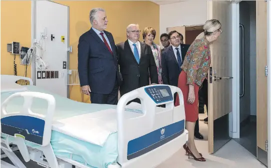  ?? DAVE SIDAWAY ?? Quebec Premier Philippe Couillard at Phase Two of the CHUM superhospi­tal on Sunday. The new complex will have 39 operating theatres and private rooms for 772 patients.