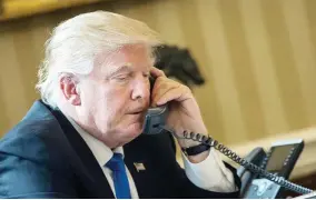  ??  ?? President Donald Trump speaks on the phone with Russian President Vladimir Putin in this file photo taken on Jan. 28. (AFP)