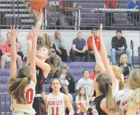  ?? RICK PECK/SPECIAL TO MCDONALD COUNTY PRESS ?? McDonald County’s Sydney Killion shoots over Webb City’s Kate Brownfield during the Lady Mustangs’ 42-33 loss on March 3 in the semifinals of the Missouri Class 4, District 12, Basketball Tournament.