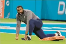  ?? JOE CAVARETTA/SOUTH FLORIDA SUN SENTINEL ?? The Dolphins’ Terron Armstead stretches Sunday at Hard Rock Stadium in Miami Gardens prior to the game against the Bills.