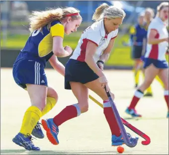  ?? FM4719595 Buy these pictures from kentonline.co.uk ?? Gabrielle Budd, left, puts pressure on Tunbridge Wells 3rds for Maidstone ladies’ 2nds