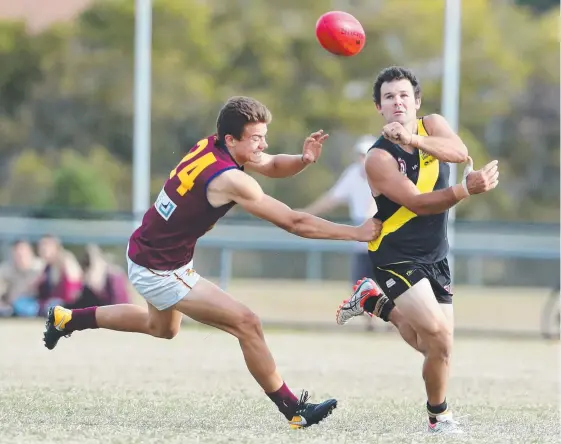  ?? Picture: RICHARD GOSLING ?? Todd Feathersto­ne (right) and his Labrador teammates have a chance to reach the QAFL decider when they face Broadbeach today.