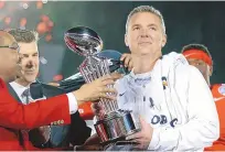  ?? JAE C. HONG/ASSOCIATED PRESS FILE ?? Urban Meyer, right, holds the trophy after his Ohio State team won the Rose Bowl on Jan. 1, 2019. Next up for the coach is the challenge of the NFL with the Jacksonvil­le Jaguars.