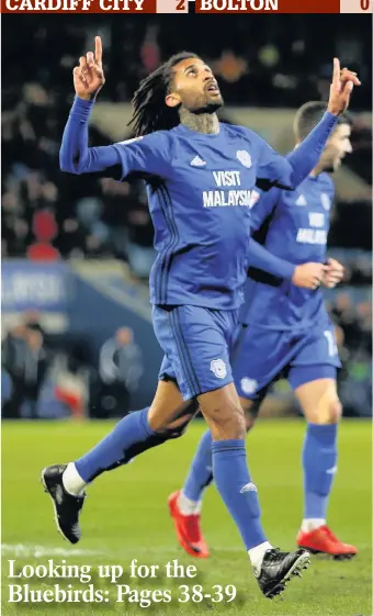  ?? HUW EVANS AGENCY ?? > Cardiff City defender Armand Traore looks to the heavens after putting the Bluebirds ahead in their 2-0 win over Bolton last night