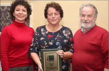  ??  ?? Helen and Paul Corrigan accept their award from Susan Donegan.