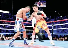  ?? — AFP photo ?? In this file photo taken on September 09, 2017, Srisaket Sor Rungvisai of Thailand (R) lands a right hand to the head of Roman Gonzalez of Nicaragua (L) at StubHub Center in Carson, California.