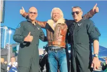  ?? JOHN ANTCZAK/ASSOCIATED PRESS ?? Virgin Galactic’s Richard Branson, center, celebrates with pilots C.J. Sturckow, left, and Mark “Forger” Stucky after Thursday’s flight.