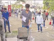  ?? PTI ?? A student sanitises his hands as he arrives to appear for the JEE (Main) in Patna on Friday.