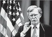  ?? FABRICE COFFRINI/GETTY-AFP ?? National security adviser John Bolton cast Wednesday’s action as a way to beef up U.S. defenses immediatel­y.