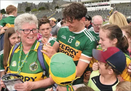  ?? Photo by Matt Browne/Sportsfile ?? David Clifford of Kerry signs an autograph for Josie Cassidy from Rathmore after the Munster GAA Football Senior Championsh­ip semifinal match between Kerry and Clare at Fitzgerald Stadium