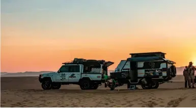  ?? ‘Ó SOLE MIO You’ll lose your heart to the desert, but the route also passes through a section of the Kaokoland where you’ll encounter elephants, giraffe and rivers in flood (bottom). You’ll remember those glorious night skies (below) for the rest of your  ??