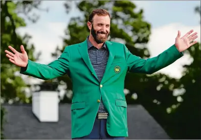  ?? MATT SLOCUM/AP PHOTO ?? Masters champion Dustin Johnson shows off his green jacket after his victory on Sunday in Augusta, Ga.
