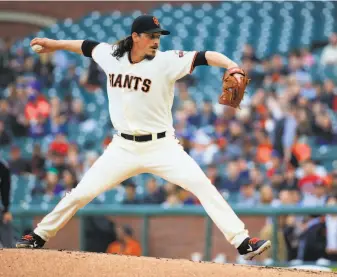  ?? Daniel Shirey / Getty Images ?? Jeff Samardzija of the Giants gave up only four hits and zero earned runs over six innings, but Atlanta took advantage of San Francisco errors to score six times in the second.