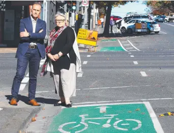  ?? ?? Councillor Eddy Kontelj and Western Victoria MP Bev McArthur study the new bike lanes on Gheringhap St, in Geelong. Picture: Alison Wynd