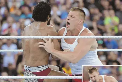  ?? AP IMAGES VIA WWE ?? SECOND CAREER? Patriots tight end Rob Gronkowski, shown wrestling with Jinder Mahal at Wrestleman­ia last year, may be in line for a contract offer from World Wrestling Entertainm­ent.