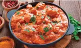  ?? ?? FANCY TWIRL
Our butter chicken, which used to be a basic dish, now has cashew paste and many fancy spices