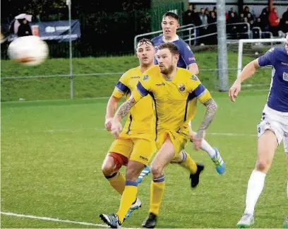  ?? BERNIE FORD ?? Player-manager Rhys Griffiths heads home the winner against Port Talbot Town