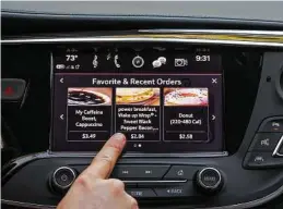  ?? John F. Martin / Chevrolet via New York Times ?? Automakers are connecting cars with technology that lets drivers order food, make reservatio­ns and pay for gas, bypassing their cellphones.