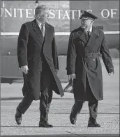  ??  ?? US President Donald Trump walks off Marine One as he makes his way to board Air Force One before departing from Andrews Air Force Base in Maryland on Tuesday.