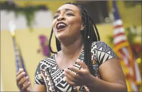  ?? Catherine Avalone / Hearst Connecticu­t Media ?? Opera singer Brandie Sutton, a soprano with the Metropolit­an Opera, performs the Black History celebratio­n on Saturday at Mount Zion Seventh-day Adventist Church in Hamden.