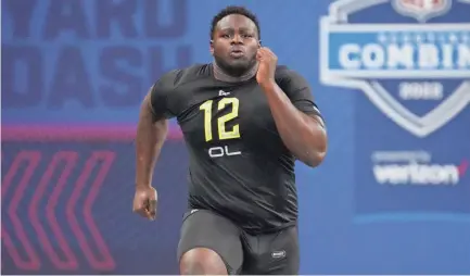  ?? KIRBY LEE/USA TODAY SPORTS ?? North Carolina State offensive lineman Ickey Ekwonu runs the 40-yard dash during the 2022 NFL Scouting Combine at Lucas Oil Stadium.