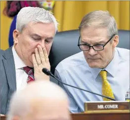  ?? Nathan Howard Associated Press ?? REP. JAMES COMER, left, with fellow GOP Rep. Jim Jordan at a hearing on the impeachmen­t inquiry, has signaled interest in taking the probe in a new direction.