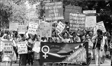  ??  ?? Women take part in a protest march on Internatio­nal Women’s Day in New Delhi in March 2016. Activists say attitudes to violence against women are changing, but conditions are worse in rural areas. (Photo: EPA)