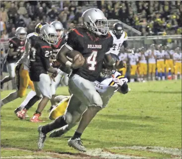  ?? Kevin Myrick / Standard Journal
Running back Tony Mathis finds an open route during Friday’s game against Troup County. ??